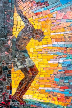 Mosaic depiction of Christ's body hanging on the cross. Concepts and religion.