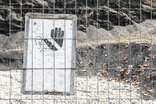 Sign prohibiting access to non-professionals on a construction site. Copy space.