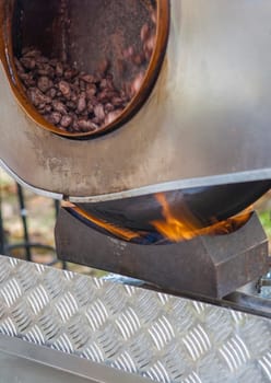 Garrapinadas processing at rotatory pot. Traditional caramel-coated almonds been processed at fair stall