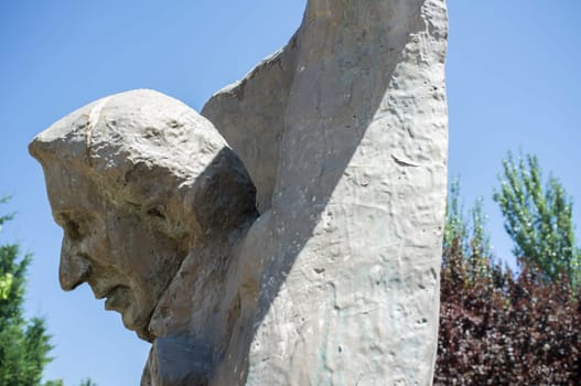 La Albuera, Spain - Jun 12th, 2021: Hans Christian Andersen monument, representing the author writing The Ugly Duckling. Badajoz, Spain.