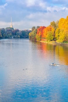 Turin, Piedmont Region, Italy - Circa November 2021: landscape in autumn with Po' river and blue sky.