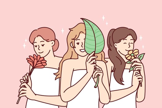 Happy women wrapped in white towels smiling after pleasant spa treatment and holding natural plants. Positive girls enjoy smell of flowers after using good shower cosmetics. Flat vector illustration