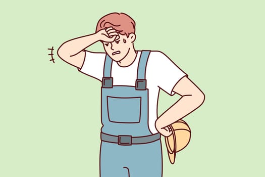 Tired man in construction uniform and safety helmet wiping forehead after completing difficult project. Sweaty guy foreman wearily looks down exhausted at end of day. Flat vector design
