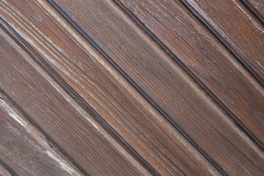 wooden boards arranged diagonally. Wood texture. Dark wood color. Background with copy space