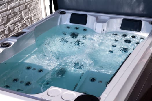 Details of a whirlpool with many jets for massage.