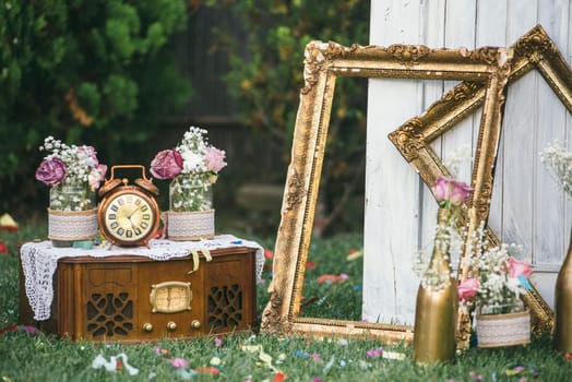 Vintage still life decoration for wedding reception. Marriage and love concept in retro style. Bridal arrangement.
