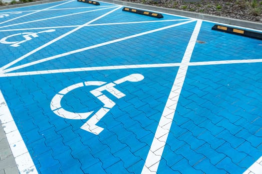 Big blue car parking spaces for disabled people