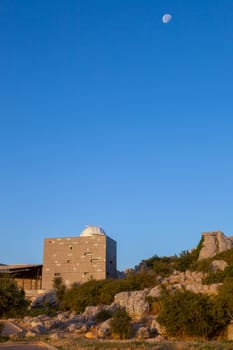 Astronomy Observatory with moon at rising. Torcal de Antequera National Park, Malaga, Spain