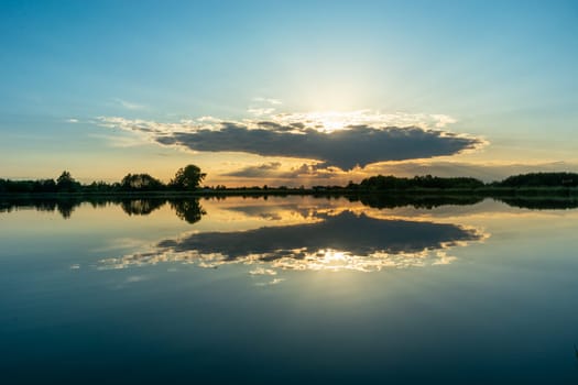 Reflection of cloud in the calm lake water