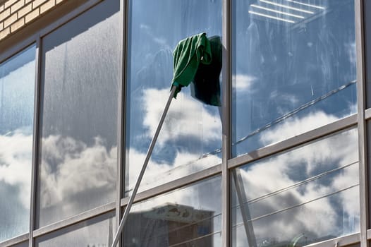 window washing, washing a street shop window. High quality photo