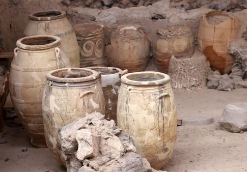 Santorini, Greece - July 01, 2021: Recovered ancient pottery in prehistoric town of Akrotiri, excavation site of a Minoan Bronze Age settlement on the Greek island of Santorini