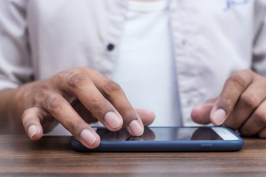 Young man using smartphone to play online games, Online games, Mobile games concept