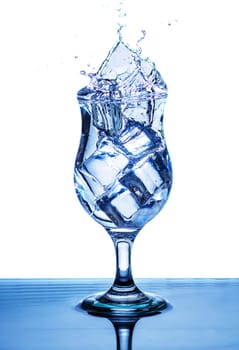 The image of pouring drinking water, into a glass, that makes one feel refreshed on blurred white background, Splashing water, Sparkling water