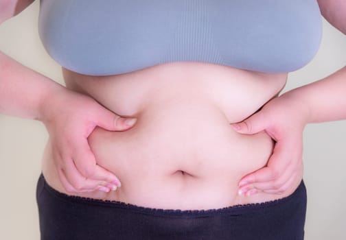 Fat woman, Shape up healthy stomach muscle, and diet lifestyle, to reduce belly concept.