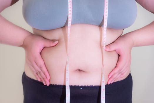Fat woman, Shape up healthy stomach muscle, and diet lifestyle, to reduce belly concept.