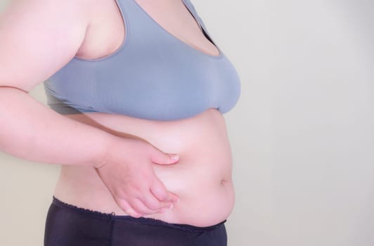 Fat woman, Shape up healthy stomach muscle, and diet lifestyle, to reduce belly concept.