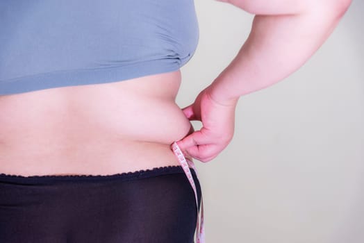 Fat woman, Shape up healthy stomach muscle, and diet lifestyle, to reduce belly concept.