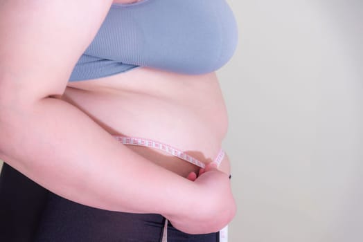 Fat woman, Shape up healthy stomach muscle, and diet lifestyle, to reduce belly concept.