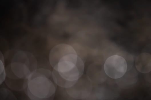 Light abstract dark bokeh christmas circle color glitter blurred black background