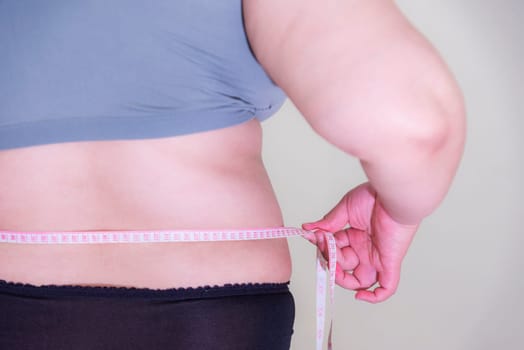 Fat woman, Shape up healthy stomach muscle, and diet lifestyle, to reduce belly concept.