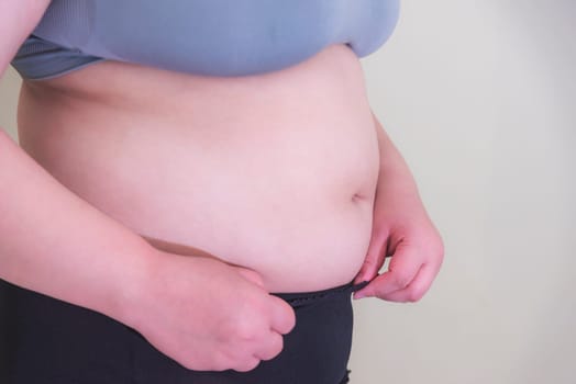 Fat woman, Shape up healthy stomach muscle, and diet lifestyle, to reduce belly concept.