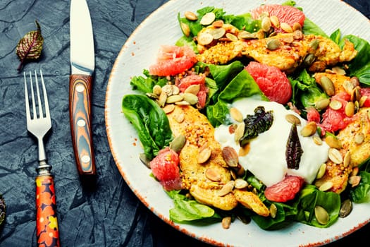 Dietary salad with chicken meat, herbs and grapefruit. Diet food