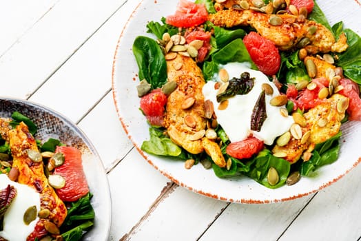 Dietary salad with chicken meat, herbs and grapefruit. Diet food
