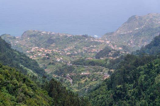 Landscape with Maderia village, mountains and ocean. Madeira island, Portugal