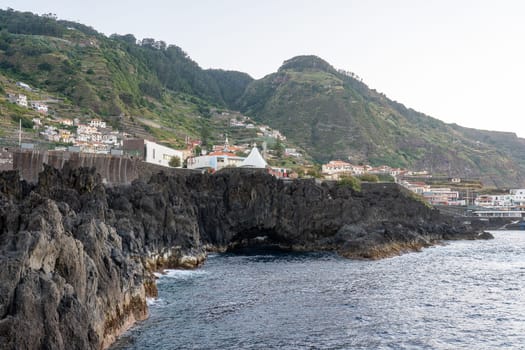 Madeira/Portugal - July 21 2021 The view of town Porto Moniz from shore.