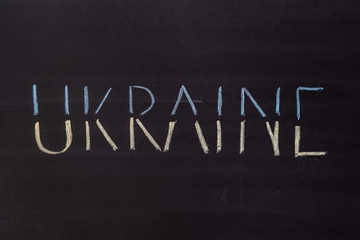 Word "Ukraine"" writed on blackboard with chalk"