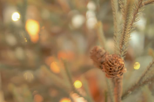 Gold Christmas background of de-focused lights with decorated tree. Decorated Christmas tree on blurred background. Happiness moment . New year background