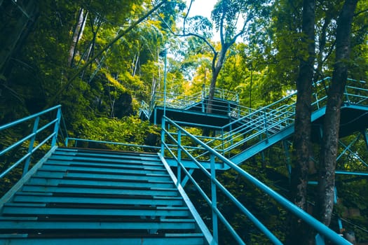 climbing stairs during fall autumn season outdoors . Autumn in the park .  yellow leaf in Autumn season . season change . turning and changing moving on concept idea background