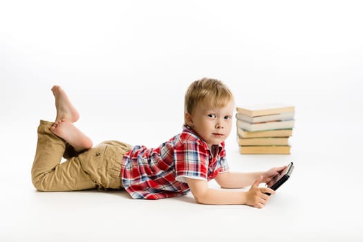Little boy with a Tablet PC. studio