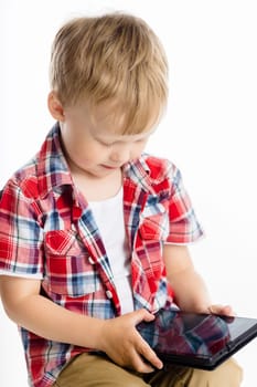 Little boy with a Tablet PC. studio