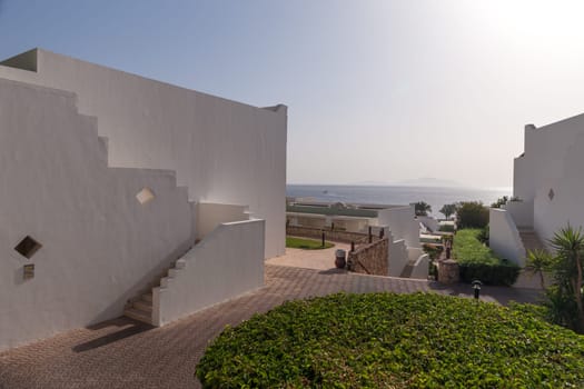 The small part of the white facade of the building in Egypt. side view