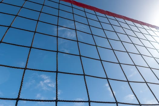 volleyball net on a background blue sky and clouds