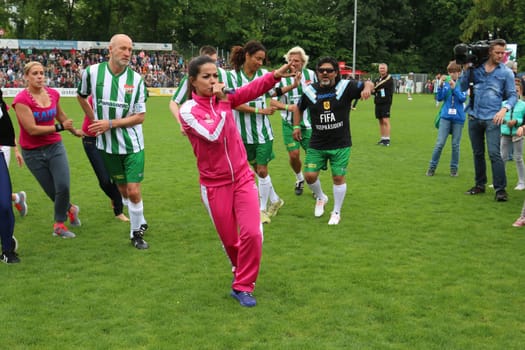 Fernanda Brandao waking up with Peter Lohmeyer,Annabelle Mandeng in the background,The charity football game Kicking with heart in the Stadion Hoheluft,Hamburg,14.06.2015