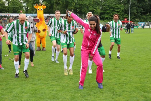 Fernanda Brandao waking up with Peter Lohmeyer,Annabelle Mandeng in the background,The charity football game Kicking with heart in the Stadion Hoheluft,Hamburg,14.06.2015