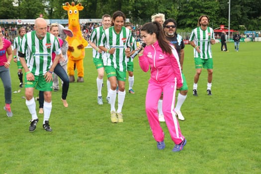 Fernanda Brandao waking up with Peter Lohmeyer,Annabelle Mandeng in the background,The charity football game Kicking with heart in the Stadion Hoheluft,Hamburg,14.06.2015