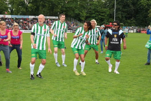 Fernanda Brandao waking up with Peter Lohmeyer,Annabelle Mandeng in the background,The charity football game Kicking with heart in the Stadion Hoheluft,Hamburg,14.06.2015