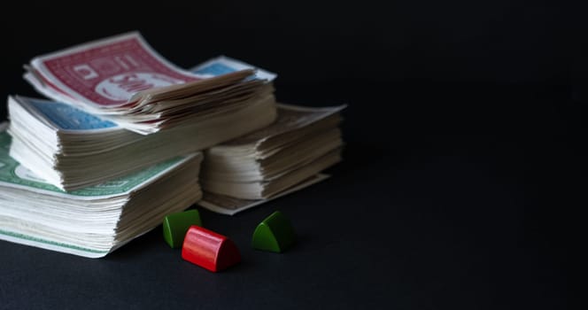 Stack of fake banknotes on black background.