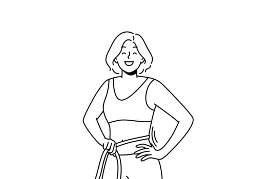 Smiling woman with tape on waist