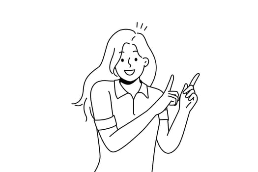 Smiling girl point up with fingers