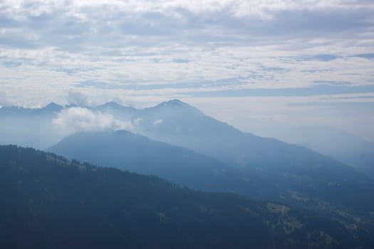 Landscape of Lienz Dolomites in Austria. Road and panorama of massive Alpine mountains