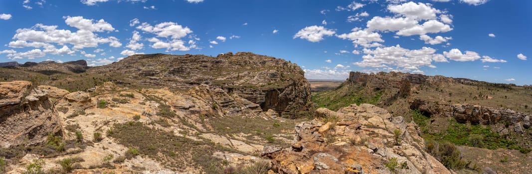 Isalo National Park in Ihorombe Region. Wilderness landscape with water erosion into rocky outcrops, plateaus, extensive plains and deep canyons. Beautiful Madagascar panorama landscape.