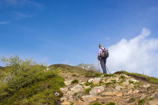 man trekking in the mountains, Alps in Austria, Lienzer Dolomiten, East Tyrol