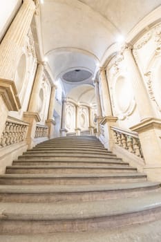 Turin, Italy - Circa January 2022: luxury marble staircase. Antique architecture interior design