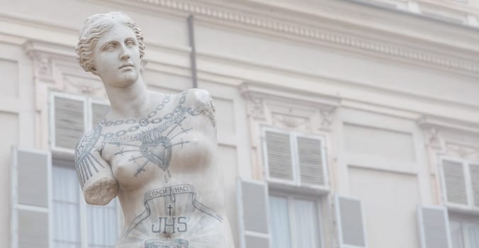 Turin, Italy - Circa January 2022: Venus de Milo with tattoos by Fabio Viale. White marble and coloured ink