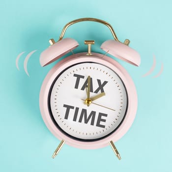 Tax time, alarm clock for taxation, deadline for payment, financial income