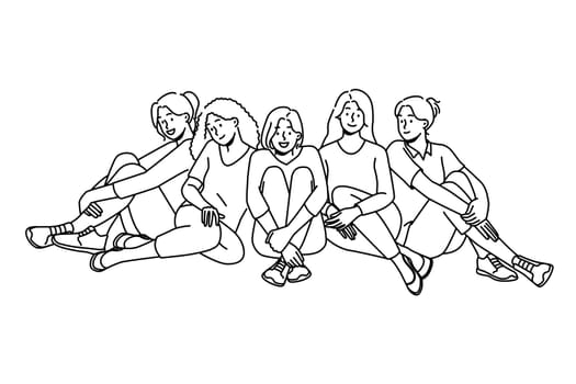 Happy multiethnic girls sitting together